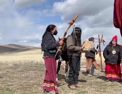Numu/Nuwu and Newe Indigenous peoples perform ceremony at Sentinel Rock