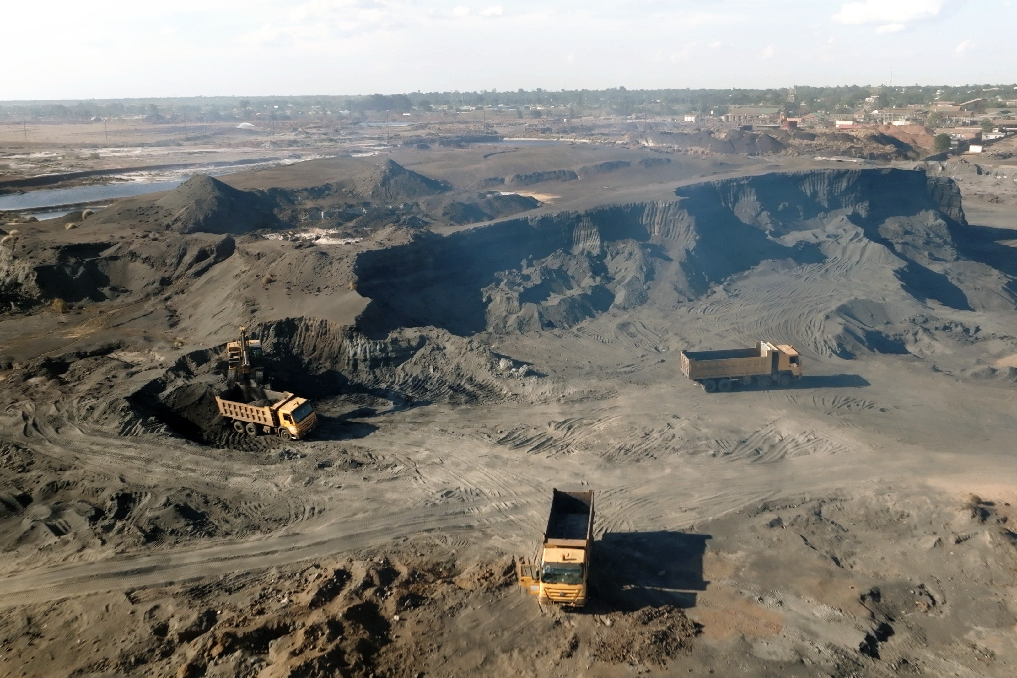 Trucks removing lead waste