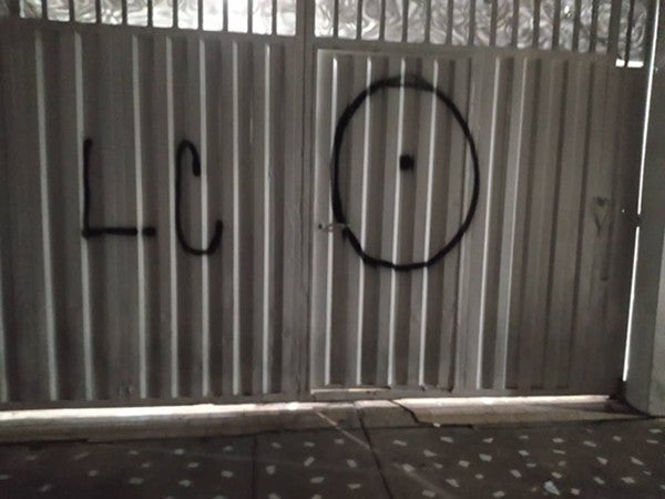 Tags spray painted on a door