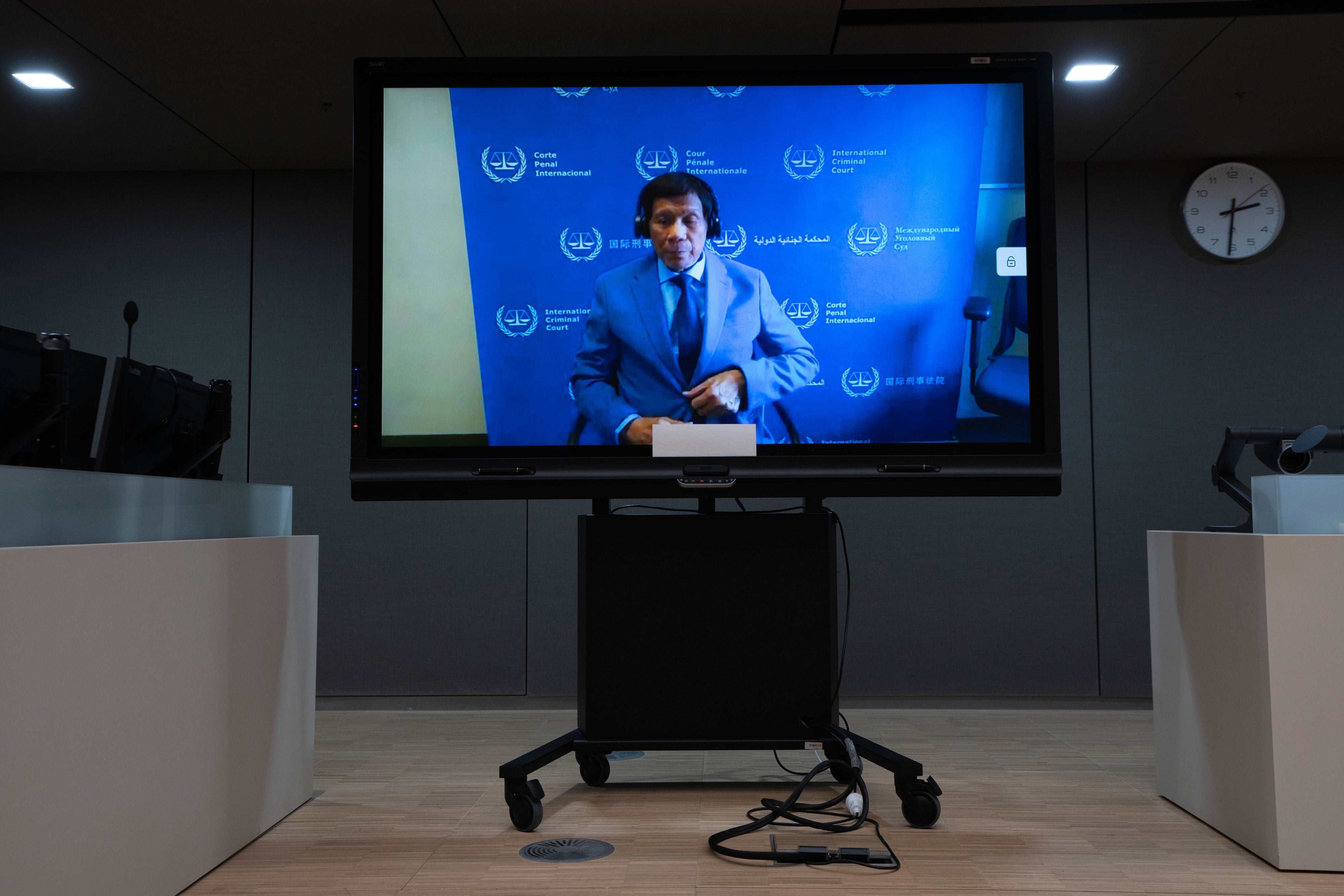 Former Philippine President Rodrigo Duterte is seen on a screen in the courtroom of the International Criminal Court, in The Hague, Netherlands, March 14, 2025.  