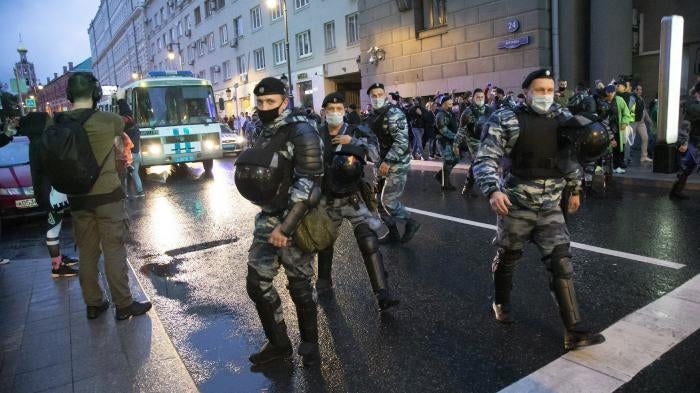 Police officers block a road in Russia’s capital