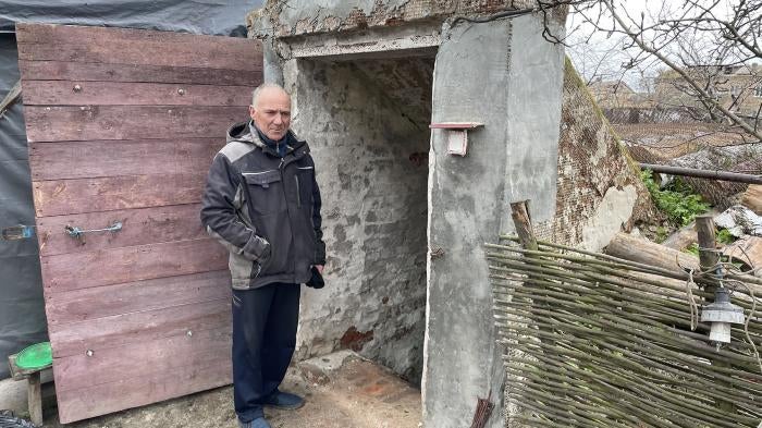 Volodymyr Ivashchenko shows the basement where he sheltered in the initial days of the war, together with his wife, mother-in-law, daughter, and 3-year-old grandson, in Yahidne, April 17, 2022.