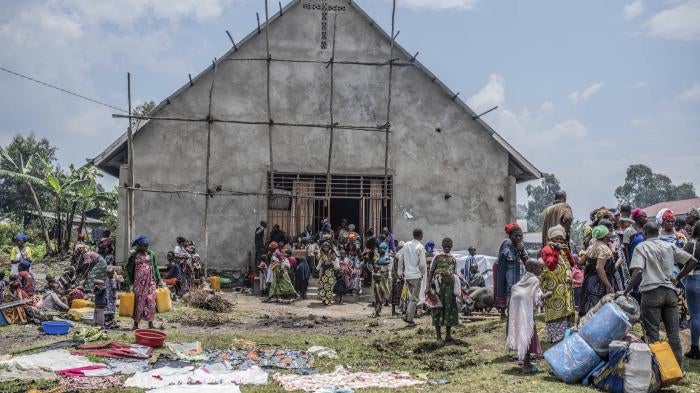 Civilians flee fighting between M23 rebels near Kivu.
