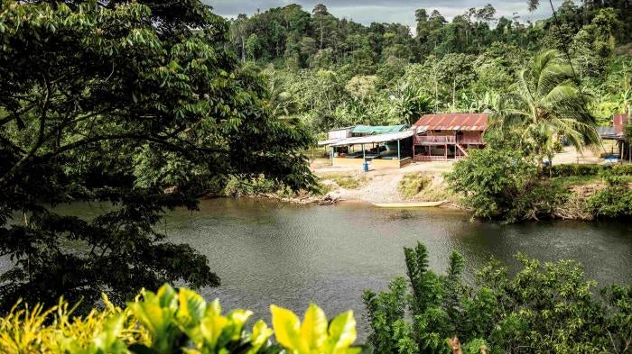 View of a river and building on a rural hillside