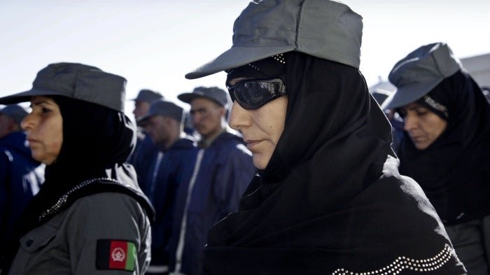 Afghan policewomen and policemen during their graduation ceremony