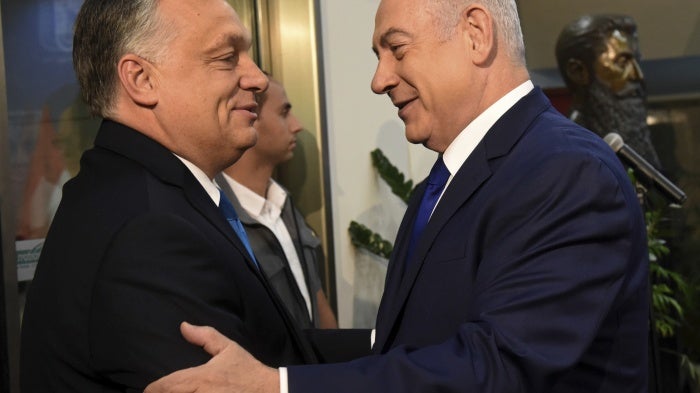 Hungarian Prime Minister Viktor Orban, left, is welcomed by Israeli Prime Minister Benjamin Netanyahu in Jerusalem, July 19, 2018. 