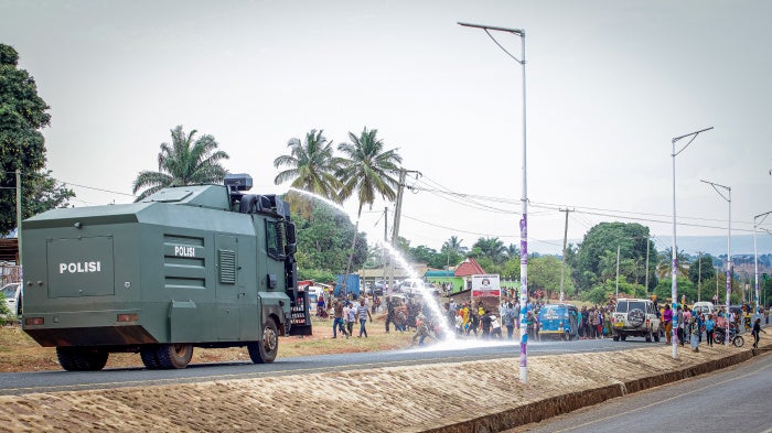 A Tanzanian police water cannon shoots water at opposition party supporters during a protest in Kigoma, Tanzania, on October 30, 2025, a day after Tanzania's presidential and legislative elections.