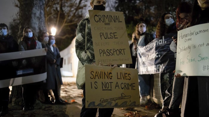 Protesters hold placards in solidarity with humanitarians who were still detained in Greece, November 18, 2021.