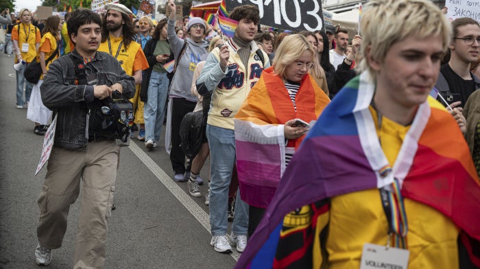 Participants at the 2025 Kyiv Pride Equality March display a placard supporting Draft Law 9103
