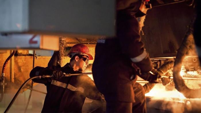 Workers at the ArcelorMittal steel plant in Temirtau, June 13, 2012.
