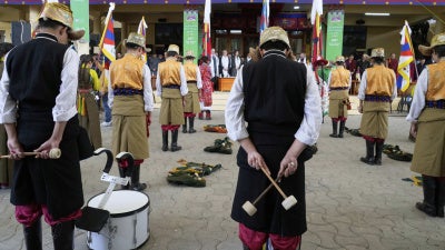 Exiled Tibetan artists observe a minute's silence as they mark the 66th anniversary of an uprising in Tibetan capital Lhasa, at the Tsuglakhang temple in Dharamshala, India, March 10, 2025.