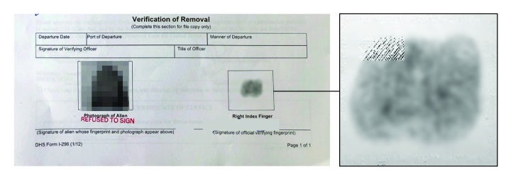 Redacted form and blurred fingerprint