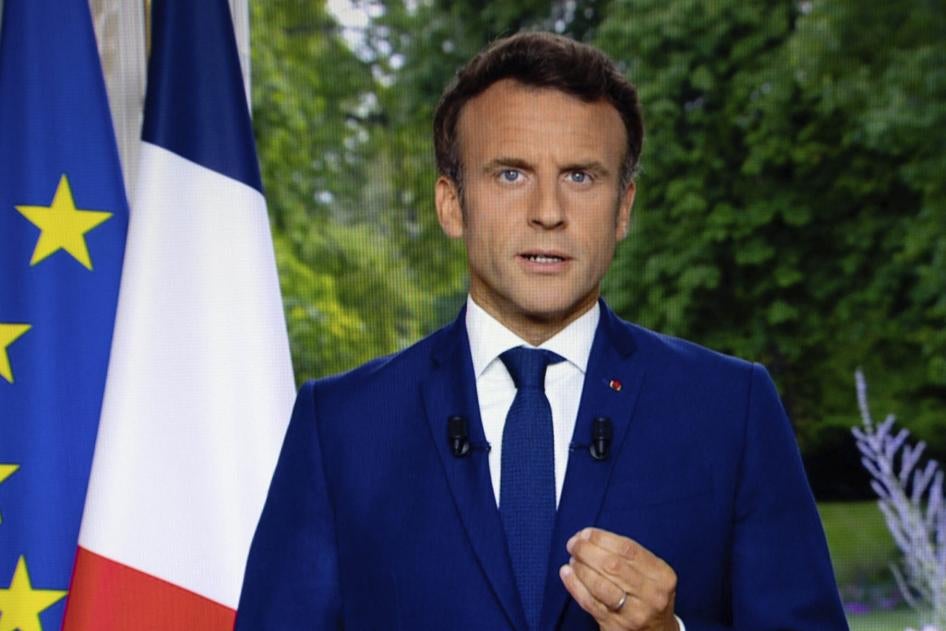 A photo of a TV screen shows French President Emmanuel Macron speaks during televised address on June 22, 2022, in Paris.