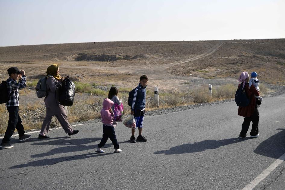 People walking along a road 