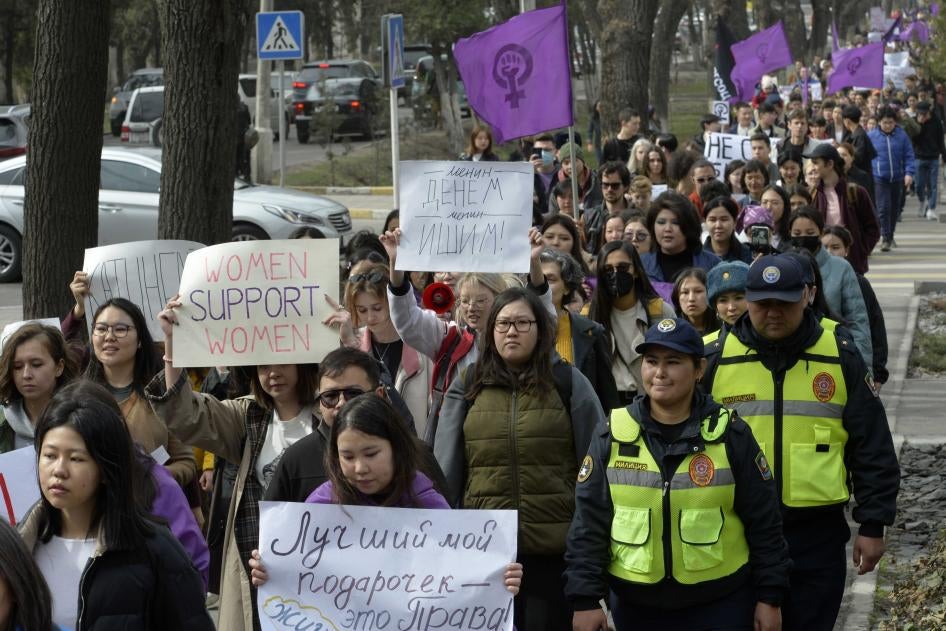Women march in a protest for International Women's Day