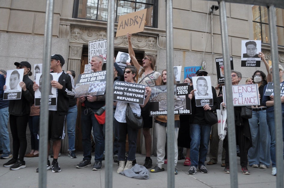 Demonstrators holding up placards