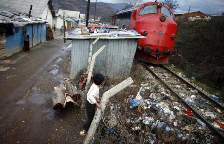 Roma children play in the Cesmin Lug refugee camp in Mitrovica city, northern Kosovo. Cesmin Lug is one of several camps that the UN established in what was known to be a heavily contaminated area near a defunct lead mine. December 12, 2007. 