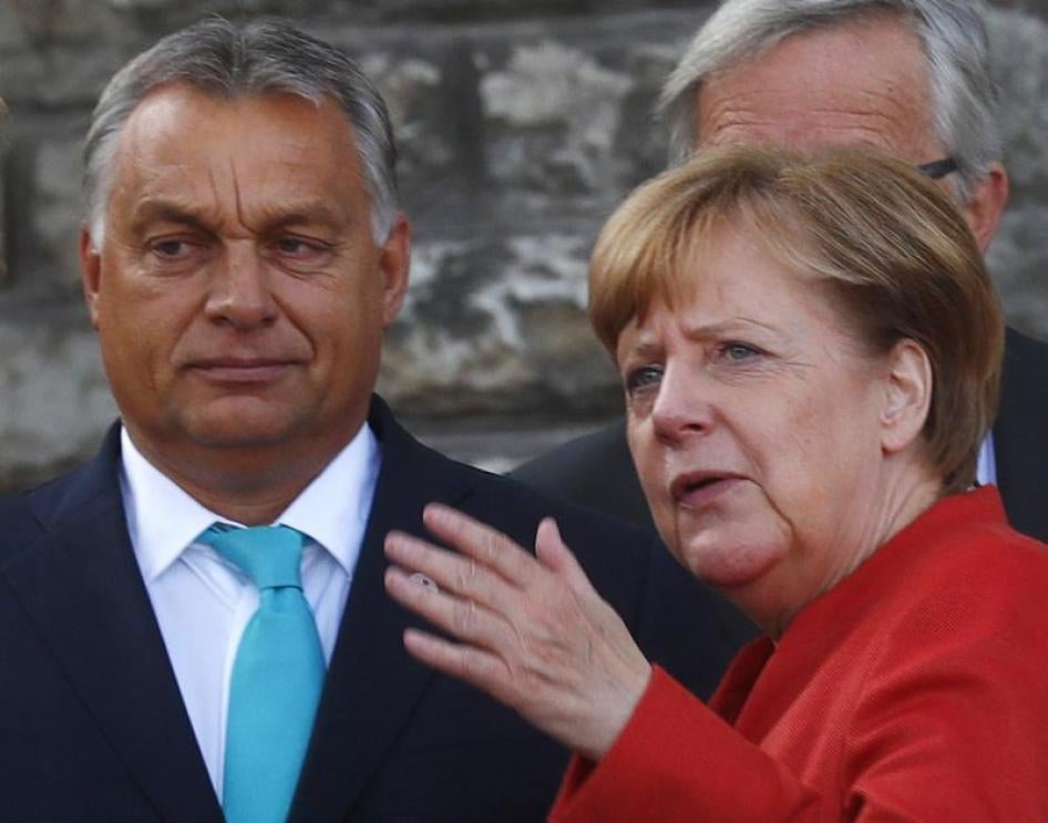 Germany's Chancellor Angela Merkel talks with Hungary's Prime Minister Viktor Orban before a photo at the European Union Tallinn Digital Summit in Tallinn, Estonia, September 29, 2017. 