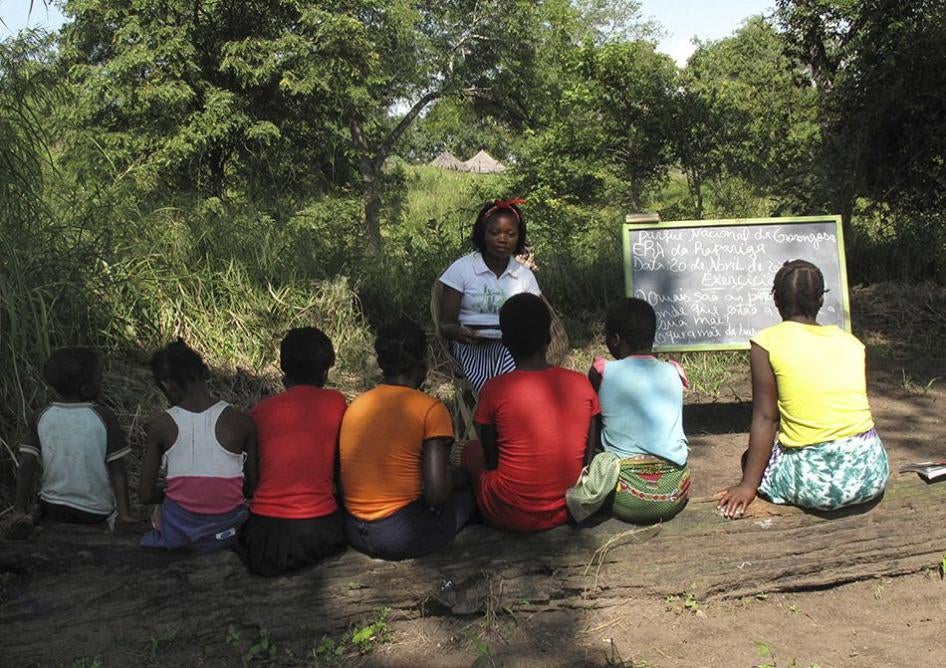 Mozambican girls take part in a lesson as part of a program that aims to help girls stay in school longer and stay out of child marriage