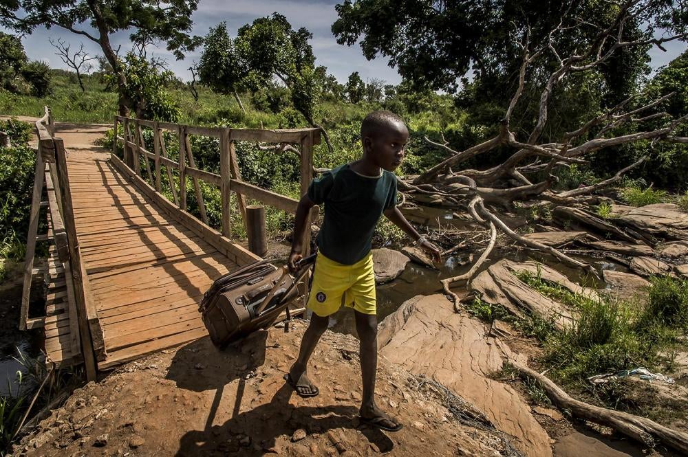   A boy at Busia, an unofﬁcial border, crossing into Uganda. More than 700,000 South Sudanese refugees have crossed into Uganda in the past year, April 13, 2017.