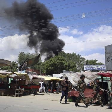 Security forces patrol as smokes rises from a maternity hospital in Kabul, Afghanistan, after gunmen attacked leading to shootout with the police and killing several people, May 12, 2020.    