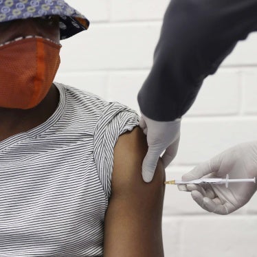 A volunteer receives a Covid-19 test vaccine injection developed at the University of Oxford in Britain, during a clinical trial at the Chris Hani Baragwanath hospital in Soweto, Johannesburg, South Africa.