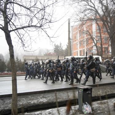 Kazakh riot police walk to block demonstrators gathering during a protest in Almaty, Kazakhstan, January 5, 2022. 