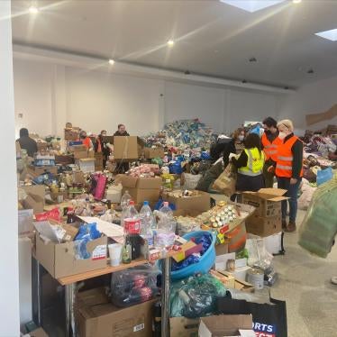 People put aid items into boxes