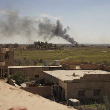 Black smoke billows from the last small piece of territory held by Islamic State forces as US-backed fighters attack the area with artillery and airstrikes in Baghouz, Syria, March 3, 2019. © 2019 AP Photo/Andrea Rosa