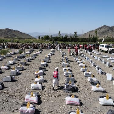 Humanitarian aid is lined up for distribution after an earthquake in Gayan village
