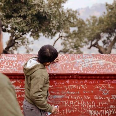 Children write in chalk on the walls of a Saraswati temple on the festival of Saraswati Puja