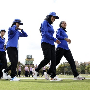 Afghan women cricket players prepare to take the field during the match between Afghanistan Women's XI and Cricket Without Borders XI in Melbourne, Australia, January 30, 2025.