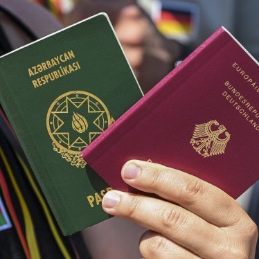 A citizen shows their German and Turkish passports in support of legal recognition for dual citizenship, Berlin, Germany, June 27, 2024.