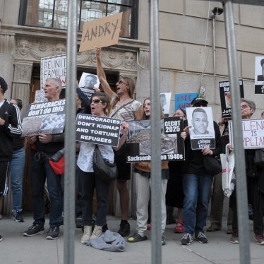 Demonstrators holding up placards