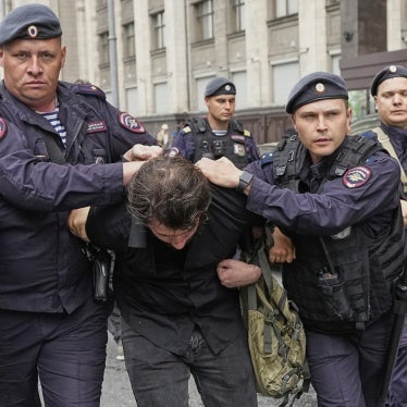Police detain an activist in front of the State Duma, the lower house of the Russian parliament, in Moscow, Russia, July 22, 2025, before lawmakers approved a bill that punishes online searches for information that is deemed "extremist."