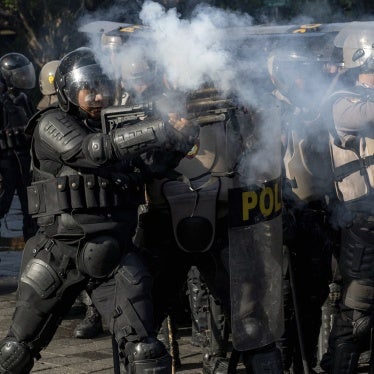 An Indonesian police officer fires tear gas during a demonstration in Jakarta, Indonesia, August 28, 2025. 