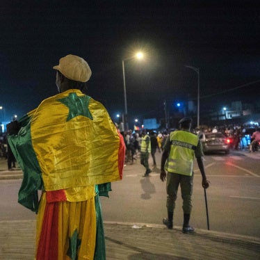 A supporter wears the Senegalese national flag in Dakar