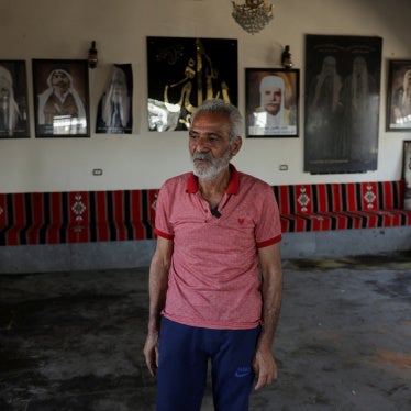 Hatem Radwan stands near bloodstains inside the Al-Radwan guest house, after a deadly shooting, in the predominantly Druze city of Sweida, Syria, July 25, 2025. 