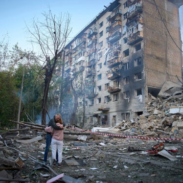Residents react after a missile hit an apartment building during Russian attacks on Kyiv, Ukraine, June 17, 2025.