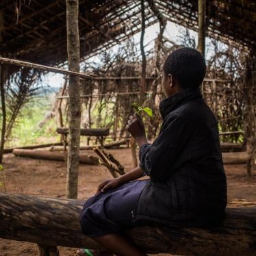 “Tshiela,” aged 10, sits in what was once her school in Mulombela village, Kasai region. The school was attacked by government forces in 2017 and five students were killed.