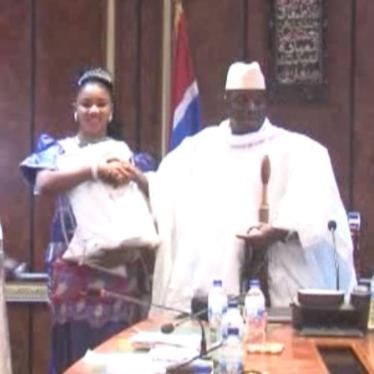 Fatou (Toufah) Jallow receiving the award from President Yahya Jammeh as winner of the Miss July 22 Pageant. Banjul, Gambia, December 24, 2014. Jallow alleges that Jammeh raped her after she refused his advances.